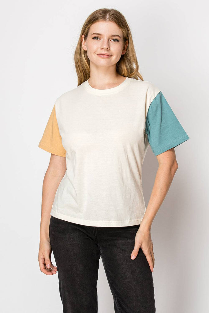 A cream color block tee featuring a stylish design, perfect for casual wear and versatile outfit combinations.