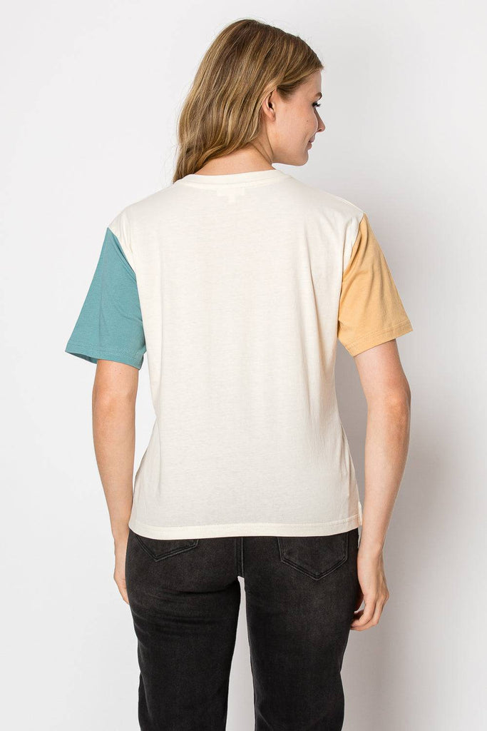 A cream color block tee designed for comfort and style, suitable for various occasions and easy to pair with other clothing.