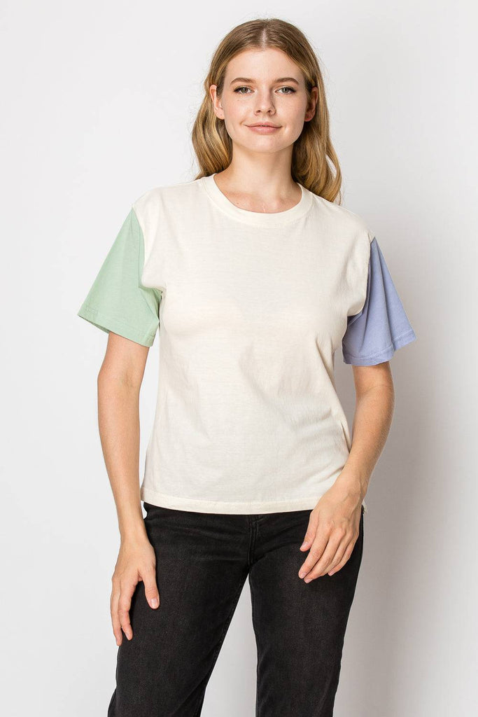 A cream color block tee designed for comfort and style, suitable for various occasions and easy to pair with other clothing.