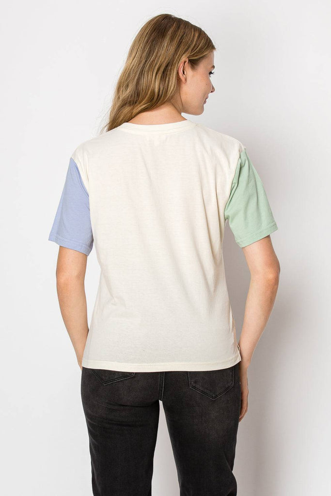 A cream color block tee designed for comfort and style, suitable for various occasions and easy to pair with other clothing.